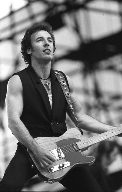 Bruce Springsteen performing with a Telecaster guitar at the Radrennbahn Weissensee in East Berlin in July 1988