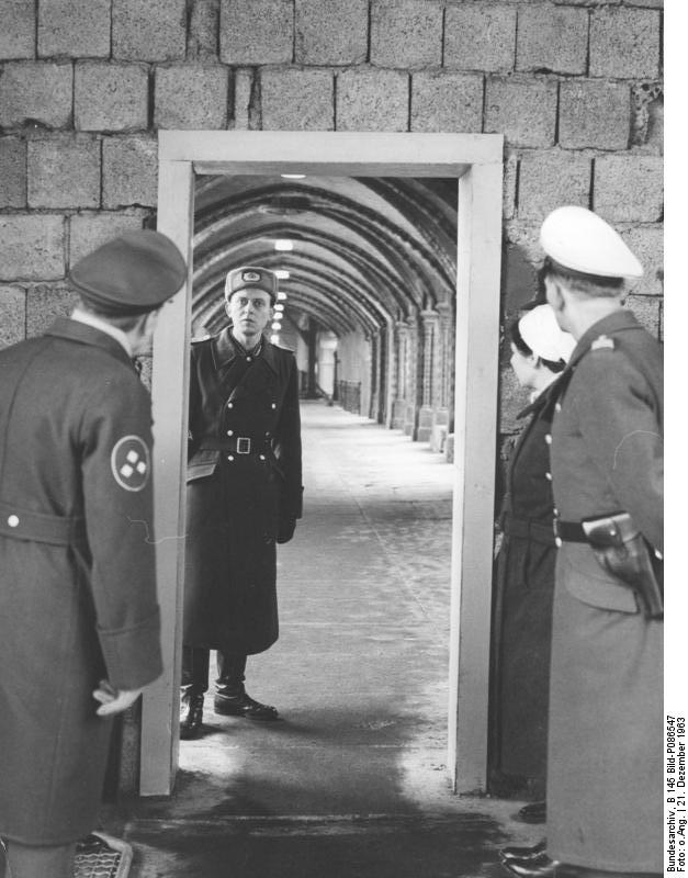 Pedestrian border crossing. Western police meet Eastern border guard 1963