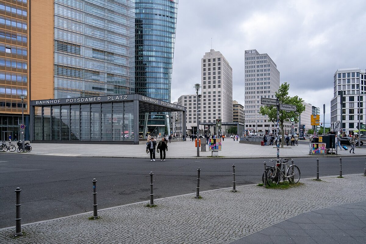 Potsdamer Platz in 2026, with high-rise buildings and station entrances where the border strip once ran