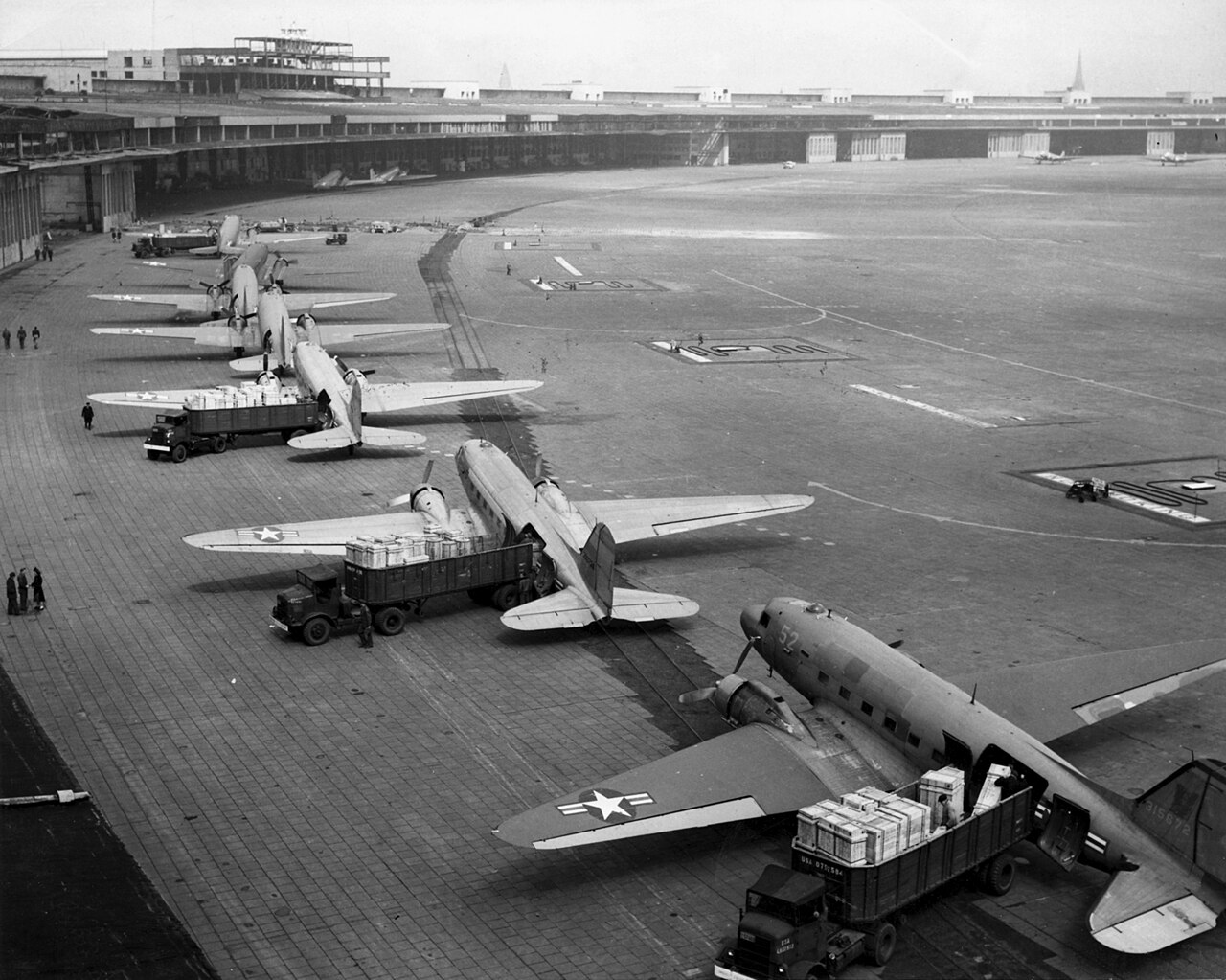C-47 transports unloading supplies at Tempelhof during the Berlin Airlift, 1948
