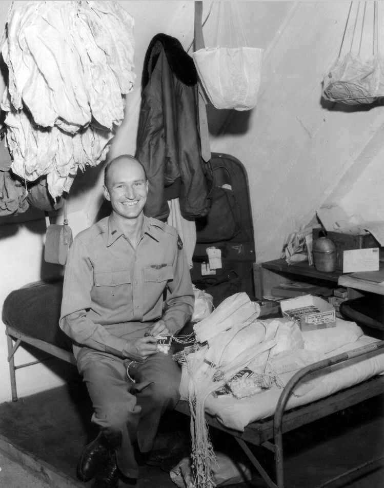 Gail Halvorsen, the Candy Bomber, preparing handkerchief parachutes for Operation Little Vittles, 1948
