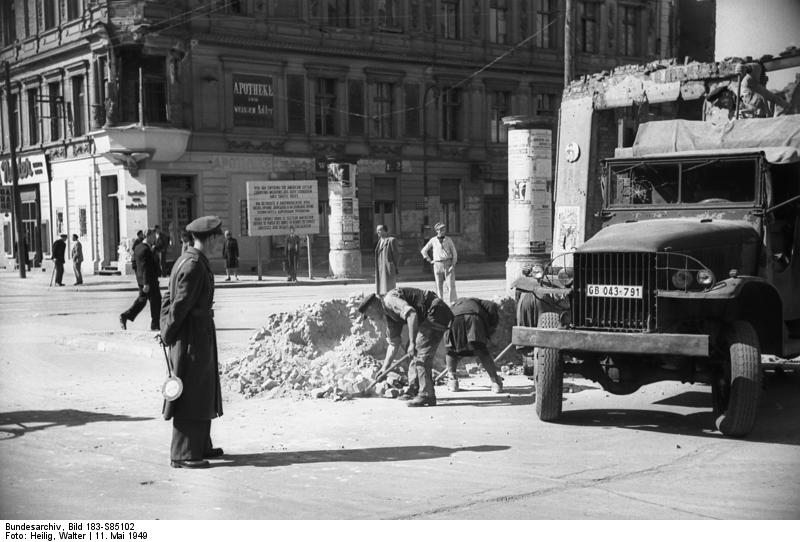 Workers removing a street barricade in Berlin as the blockade ends, 11 May 1949