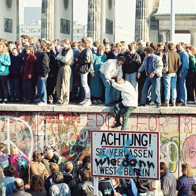 Crowds on the Berlin Wall at the Brandenburg Gate, November 1989